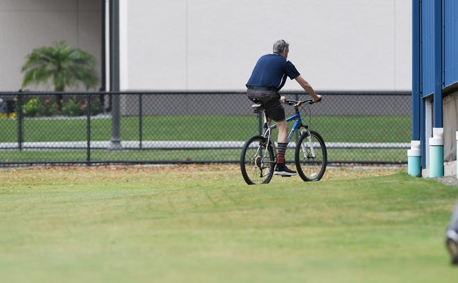 Entering his 42nd season with the Tigers, clubhouse manager Jim Schmakel gets around on his usual mode of transportation at spring training, his trusty bike.
