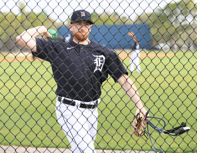 Tigers pitcher Spencer Turnbull warms up by throwing a ball against the fence at Detroit Tigers spring training with pitchers and catchers workout in Lakeland, Fla. on Feb. 13, 2020.
