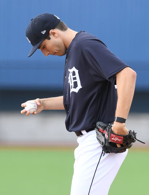 Tigers pitcher Alex Faedo prepares to throw to home during pitchers fielding practice.