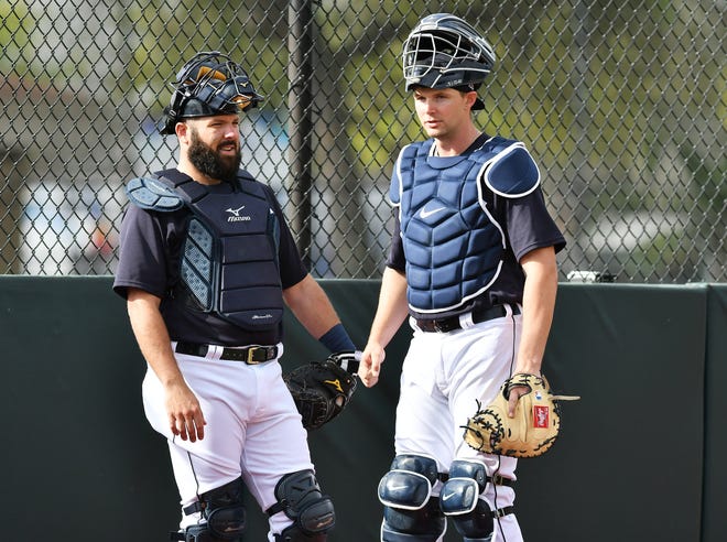 From left, Tigers catchers Austin Romine and Grayson Greiner before the bullpen sessions start.