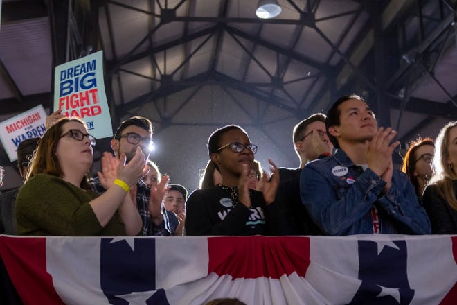 The audience listens as presidential candidate Senator Elizabeth Warren speaks during a campaign stop inside Shed 5 at Eastern Market, in Detroit, March 3, 2020.