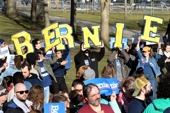 Supporters of U.S. Senator and presidential candidate Bernie Sanders spell out his name on the Diag, on the campus of The University of Michigan, Sunday, March 8, 2020 in Ann Arbor, Mich.
