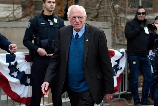 U.S. Senator and presidential candidate Bernie Sanders makes his way to the stage on the campus of The University of Michigan, Sunday, March 8, 2020 in Ann Arbor, Mich.