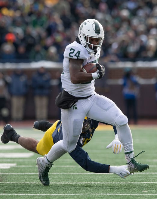 Oct. 10, at Michigan State (7-6, 4-5 Big Ten in 2019): On paper, this game looks like a Michigan win, but that has been said many times in this series with different results. If one of coach Jim Harbaugh’s top lieutenants, defensive coordinator Don Brown, can devise a scheme to stop Michigan State running back Elijah Collins  (pictured), it’s unlikely new Michigan State coach Mel Tucker will be able to find anything else on offense. Especially in Tucker’s first season, Harbaugh has enough to win this one on the road. Prediction: Win