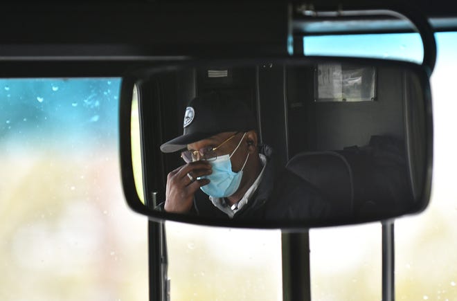 Andrew Love drives the 17 bus on Eight Mile Road in Detroit on May 18, 2020. To protect the health and safety of our customers and employees, DDOT is temporarily suspending fare collection for all trips and requesting that customers limit non-essential bus travel until further notice.
