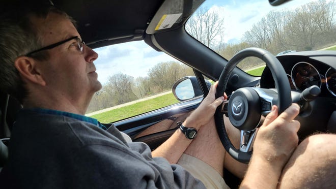 6'5" Detroit News auto critic Henry Payne squeezed into the tiny 2020 Mazda MX-5 Miata with his head stuffed into the roof and his knees in the dash.