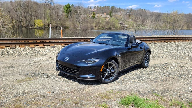 The 2020 Mazda MX-5 continues a 30-year Miata legacy of small, sub-2,500-pound cars that are fun on the track and off.