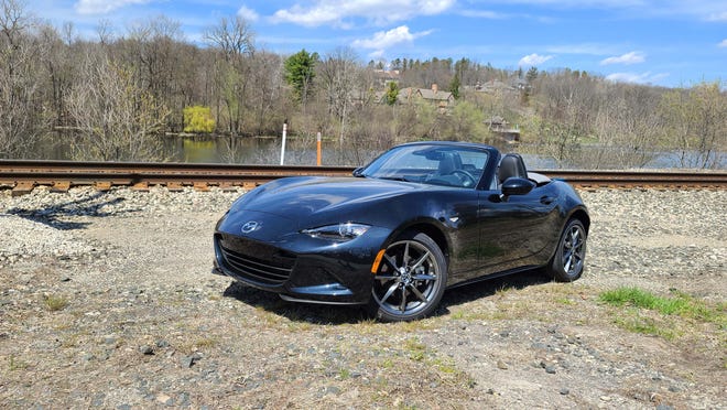 The 2020 Mazda MX-5 continues a 30-year Miata legacy of small, sub-2,500-pound cars that are fun on the track and off.