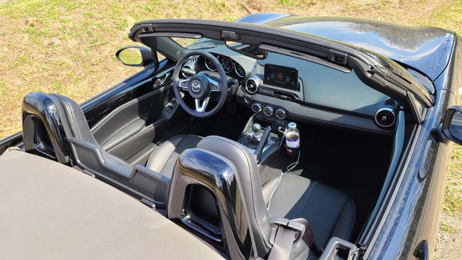 The cockpit of the 2020 Mazda MX-5 Miata. Manual and automatic 6-speeds are available, but the manual is particularly enjoyable for throwing the wee sports car around.