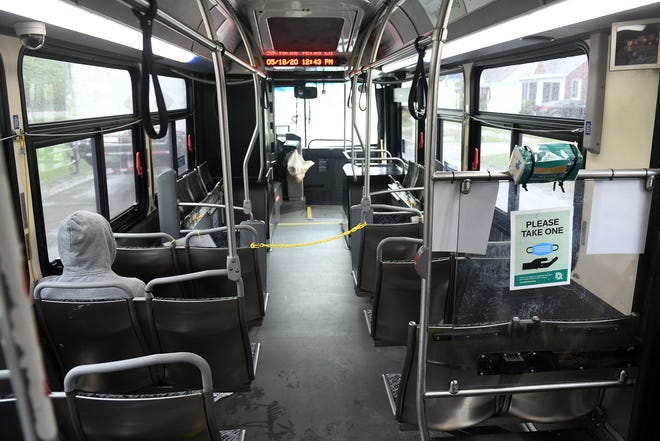 The mask box is empty on the 17 bus because the driver keeps them and hands them out when necessary to prevent them from being stolen in Detroit on May 18, 2020. The driver had witnessed people grabbing a handful of masks. To protect the health and safety of our customers and employees, DDOT is temporarily suspending fare collection for all trips and requesting that customers limit non-essential bus travel until further notice.
