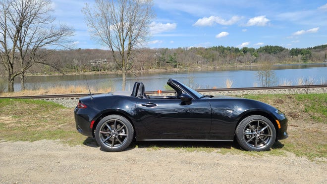Topless. The 2020 Mazda MX-5 Miata is a roadster with a soft top that can be easily stuffed behind the rear seats without stepping out of the car.