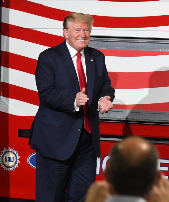President Donald J. Trump comes out to applause to make remarks after touring the Ford Motor Company Rawsonville Components Plant, one of the many repurposed American factories producing personal protective equipment and ventilators in the fight against the COVID-19 pandemic in Ypsilanti, Michigan on May 21, 2020.