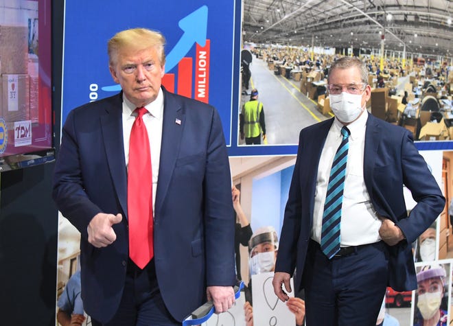 President Donald J. Trump and Executive Chairman of Ford Motor Company Bill Ford Jr. during a tour of the Ford Motor Company Rawsonville Components Plant which is producing PPE in the fight against the COVID-19 pandemic in Ypsilanti, Michigan on May 21, 2020.