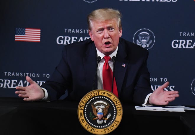 President Donald J. Trump answers questions from the media after participating in a listening session with African American leaders before touring the plant.