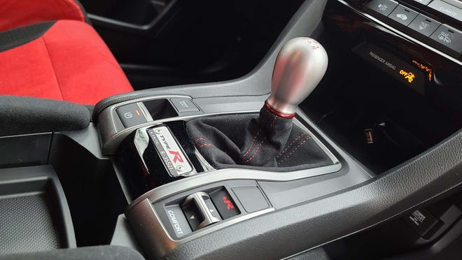 About 13,000 Type Rs have been sold. The 2020 Honda Civic Type R gets a console badge identifying its production number.