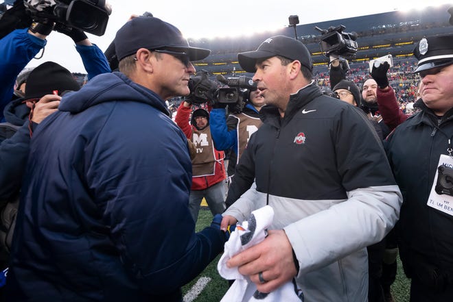 Go through the gallery to view The Detroit News' ranking of the Big Ten head football coaches, including Michigan's Jim Harbaugh (left) and Ohio State's Ryan Day (right), with analysis from Matt Charboneau.