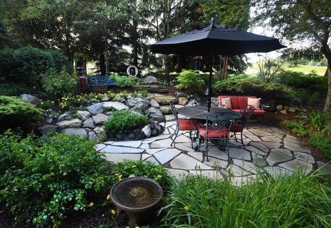 English Gardens helped the couple install a terrace area in the southeast corner of the yard.