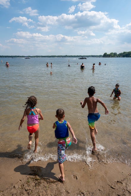 Children enjoy a day of warm weather at Mercer Beach, in Walled Lake, June 30, 2020.