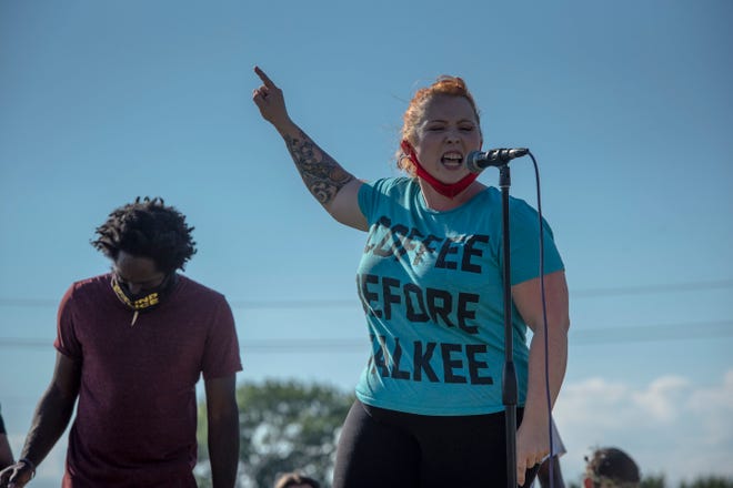 Samantha Phillips, 31, of White Lake speaks to protesters gathered outside of the Detroit Police Department ' s 4th Precinct in Detroit on June 30, 2020.