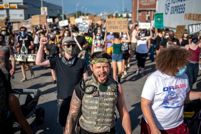 Ethan Ketner, 29, of Ann Arbor chants while marching against police brutality in Detroit on June 30, 2020. Ketner said he came to support the group Detroit Will Breathe.