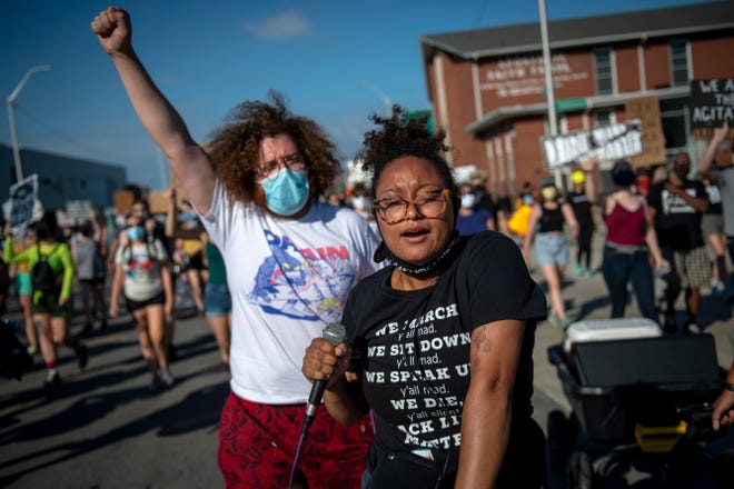 Sammie Lewis, 23, of Detroit chants while marching against police brutality in Detroit on June 30, 2020.