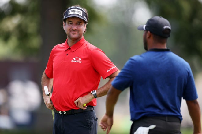 Bubba Watson and Harold Varner share a smile during their charity match win in Detroit in 2020.