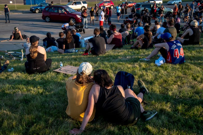 Protesters gather outside of the Detroit Police Department's 4th Precinct in Detroit on June 30, 2020.
