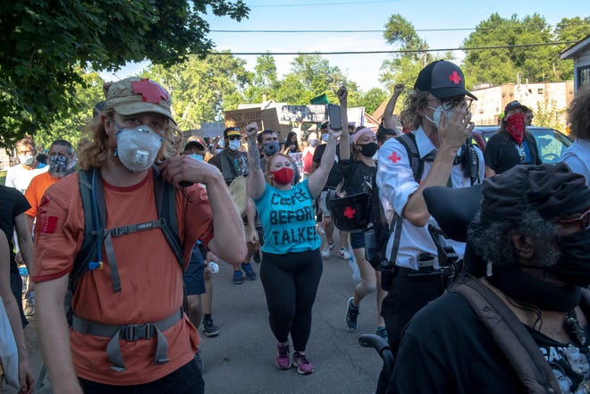 Protesters march against police brutality in Detroit on June 30, 2020.