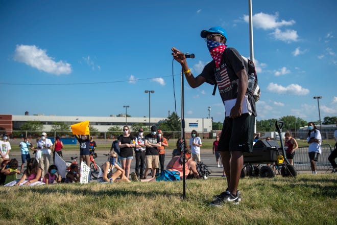 Quentas Ruffin, 35, of Detroit speaks to protesters outside of the Detroit Police Department's 4th Precinct in Detroit on June 30, 2020.