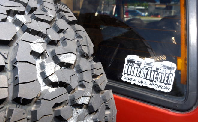 The all-terrain spare tire mounted on the rear of the 1986 Ford Bronco II owned by Merry Parks.