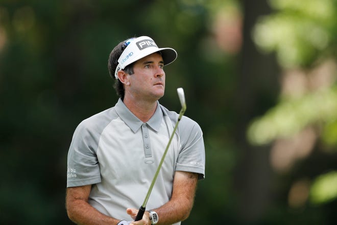 Bubba Watson watches his drive on the 11th tee during the first round.