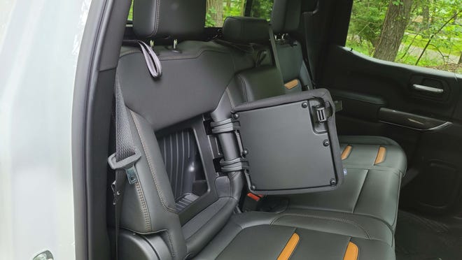 The 2020 GMC Sierra AT4 features hidden storage for clothes or a laptop behind the rear seats.