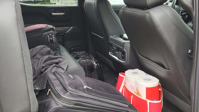 The 2020 GMC Sierra AT4 Crew Cab has lots of room in the second row. But when traveling with four people, best to get a tonneau bed cover so you throw luggage in the box.