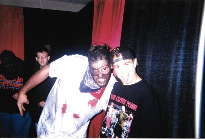Blaze Ya Dead Homie poses with George Vlahakis at the Gathering of the Juggalos festival.