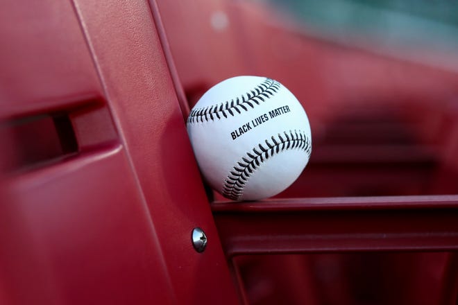 A view of an official Rawlings baseball stitched and stamped for Black Lives Matter during a baseball game between the Detroit Tigers and the Cincinnati Reds at Great American Ballpark in Cincinnati, Friday, July 24, 2020. The Reds won 7-1.