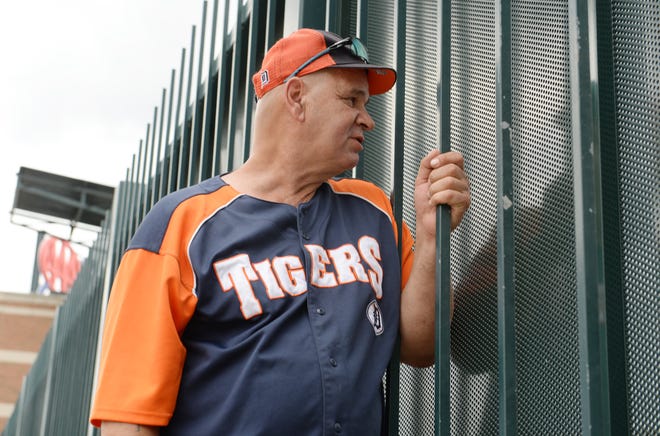 David Willis, 60, of Detroit, watches the pregame players warm up from the center-field fence of Comerica Park as Tigers fans prepare for home opener at Comerica Park in downtown Detroit, Monday, July 27, 2020. Willis said he has been doing this for the last 10 years from the same spot
