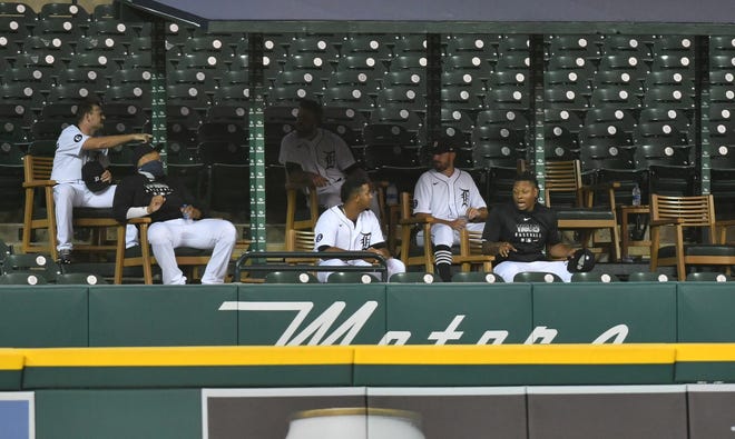 Tigers pitcher Gregory Soto, right, talks with pitcher Rony Garcia in the bullpen overflow, which was built in the left-center field seats.