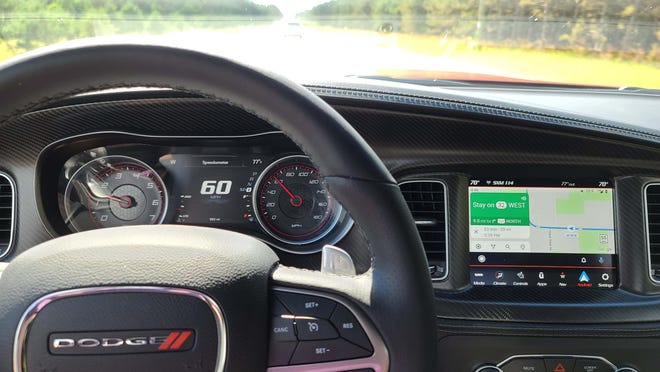 The driver-focused cockpit of the 2020 Dodge Charger Scat Pack Plus offers multiple gauges, a digital display and a center screen that can be taken over by smartphone apps.