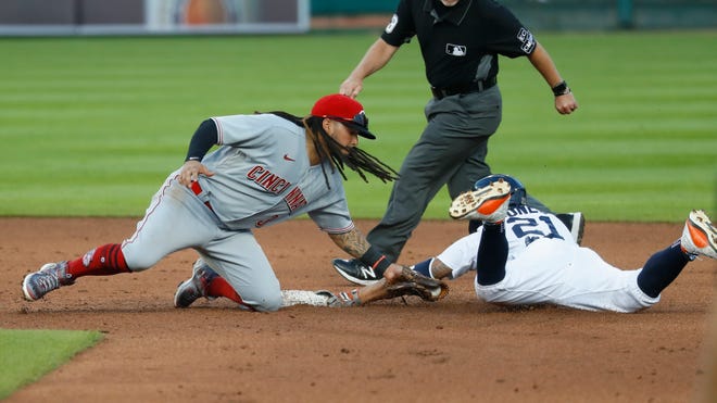 Cincinnati Reds shortstop Freddy Galvis (3) tags Detroit Tigers' JaCoby Jones (21) out at second base in the sixth inning of a baseball game in Detroit, Friday, July 31, 2020. (AP Photo/Paul Sancya)