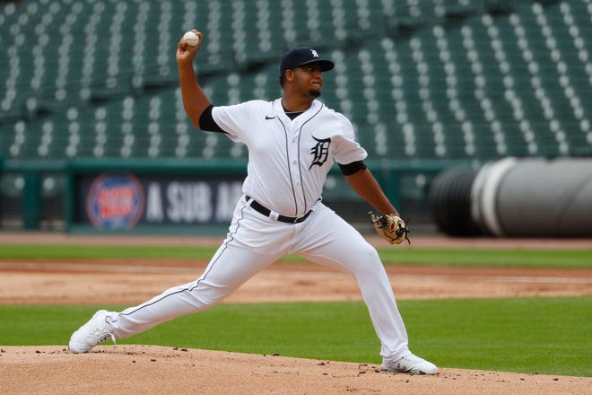 Tigers starter Rony Garcia pitches against the Reds in the first inning of the first game of a doubleheader.