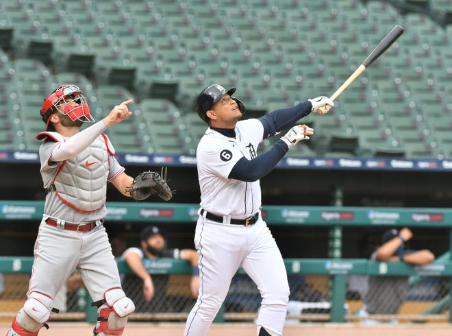 Reds catcher Curt Casali and Tigers designated hitter MIguel Cabrera watch Cabrera fly out in the first inning.