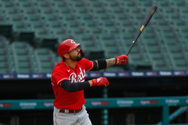 Cincinnati Reds' Nicholas Castellanos watches his solo home run against the Detroit Tigers in the third inning of the first baseball game of a doubleheader in Detroit, Sunday, Aug. 2, 2020.