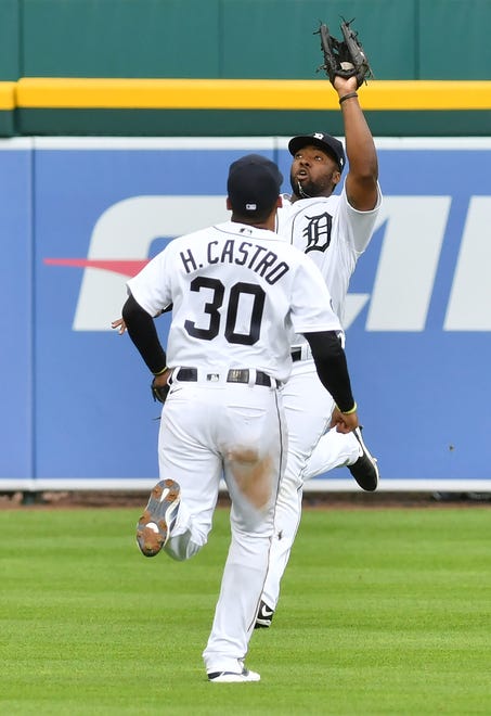 Tigers shortstop Harold Castro (30) runs while left fielder Christin Stewart makes a running catch in the third inning.