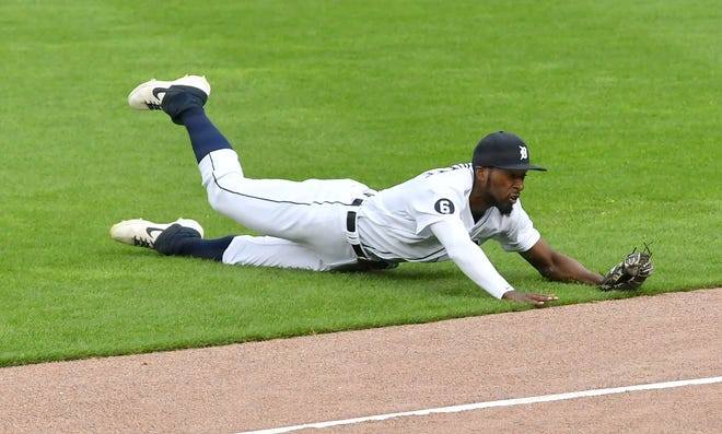 Tigers right fielder Travis Demeritte makes a diving catch in the sixth inning. Reds win 4-0.