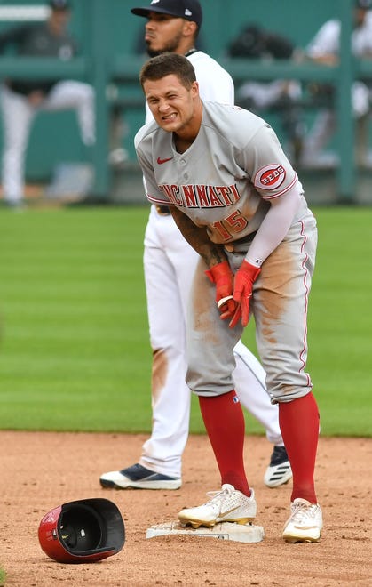 Reds ' Nick Senzel is in pain after he is safe sliding into second base on his double in the third inning.