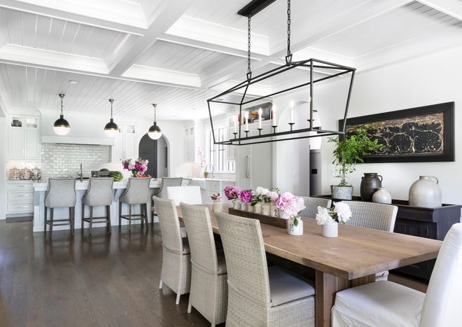 V Groove planking runs along the kitchen ceiling, giving it a textured feel. Above the eat-in area is a coffered ceiling. “It gives that eating space its own feel,” Kim said. The light fixtures are from Visual Comforts.