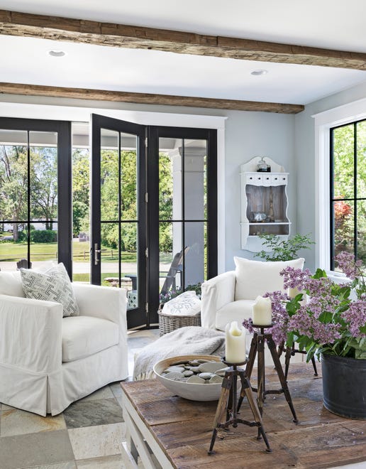 French doors along one wall in the lake room open to the front porch.