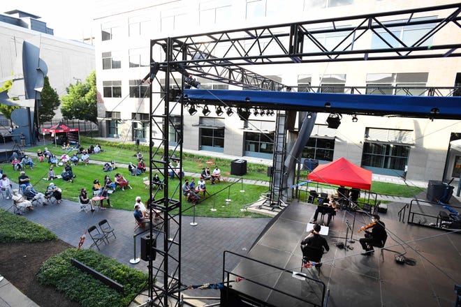 Detroit Symphony Orchestra kicks off Outdoor Performance Series with a string trio of Kimberly Kaloyanides Kennedy on violin, Eric Nowlin on viola and Wei Yu on cello at Sosnick Courtyard in Detroit, Michigan on August 5, 2020.