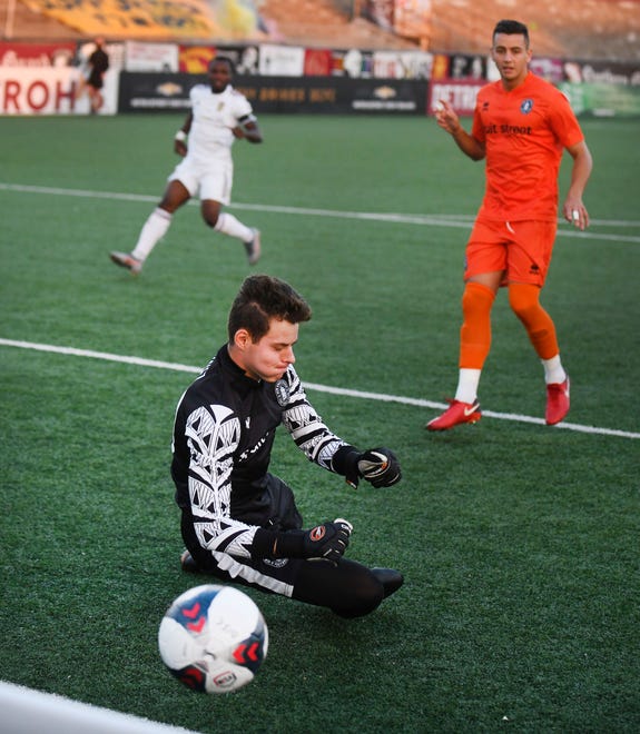 New Amsterdam FC's Aldo Munoz makes a stop early in the first half.