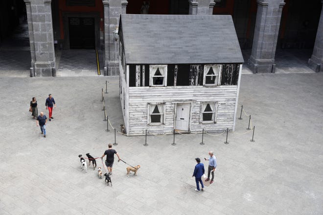 The house of U.S. civil rights campaigner Rosa Parks, rebuilt by artist Ryan Mendoza, is on display in the courtyard of an 18th century Royal Palace, in Naples, Italy, Tuesday, Sept. 15, 2020. Itâ€™s the latest stop for the house in a years-long saga that began when Parksâ€™ niece saved the tiny two-story home from demolition in Detroit after the 2008 financial crisis. (AP Photo/Gregorio Borgia)